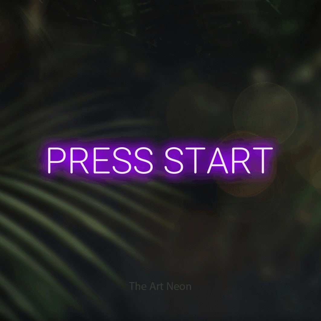 LED neon sign reading “PRESS START”, arranged in a single line.