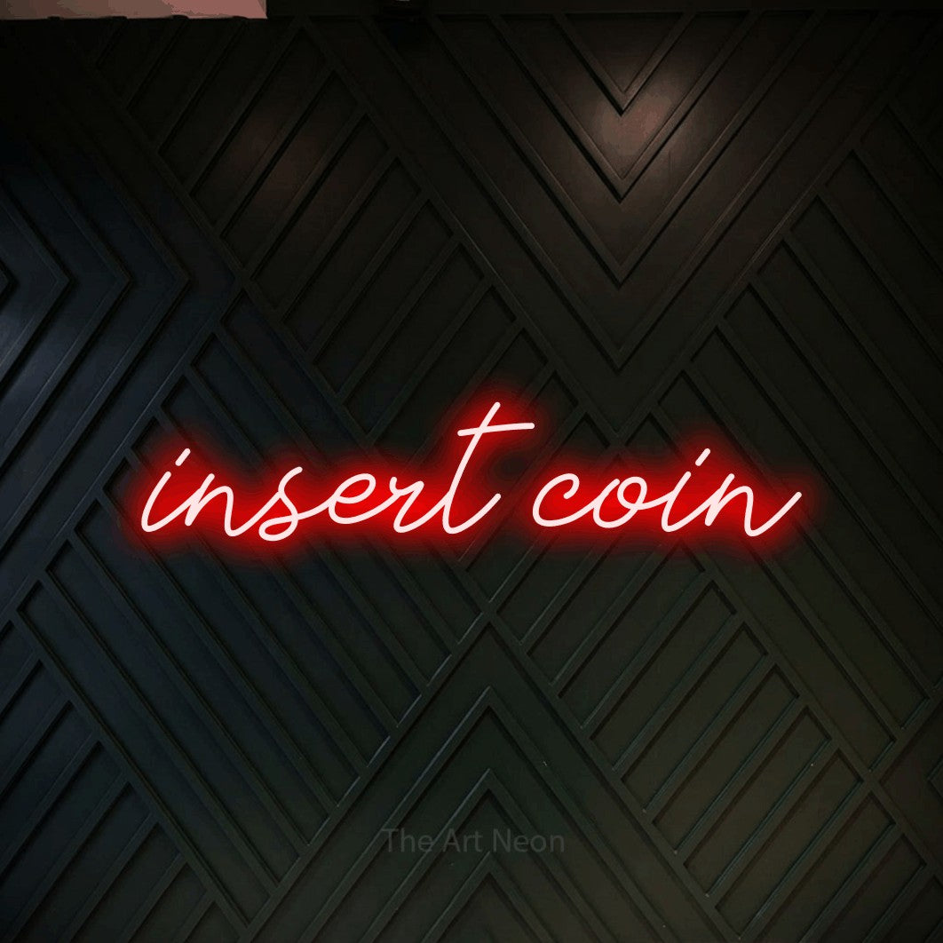 LED neon sign reading “insert coin”, arranged in a single line.