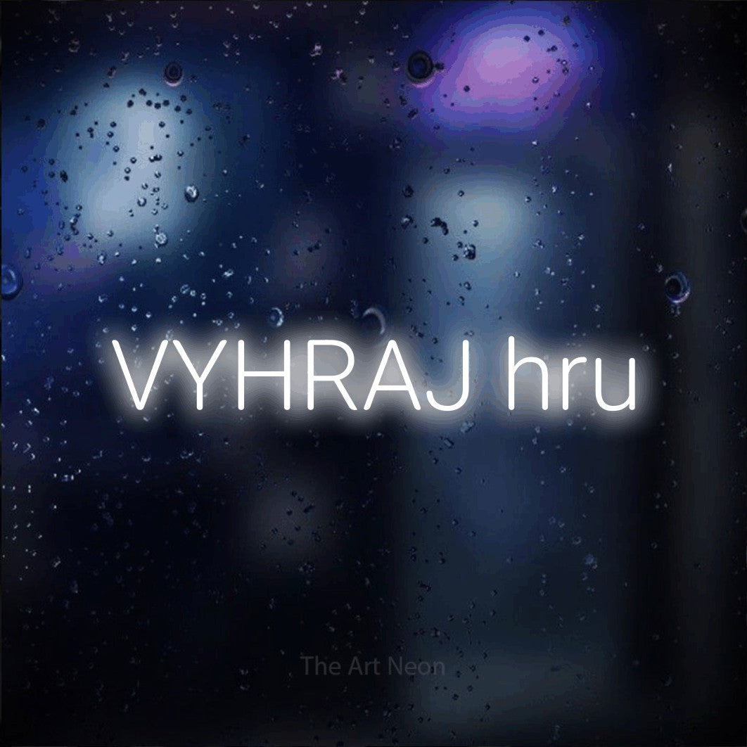 LED neon sign reading “VYHRAJ hru”, arranged in a single line.