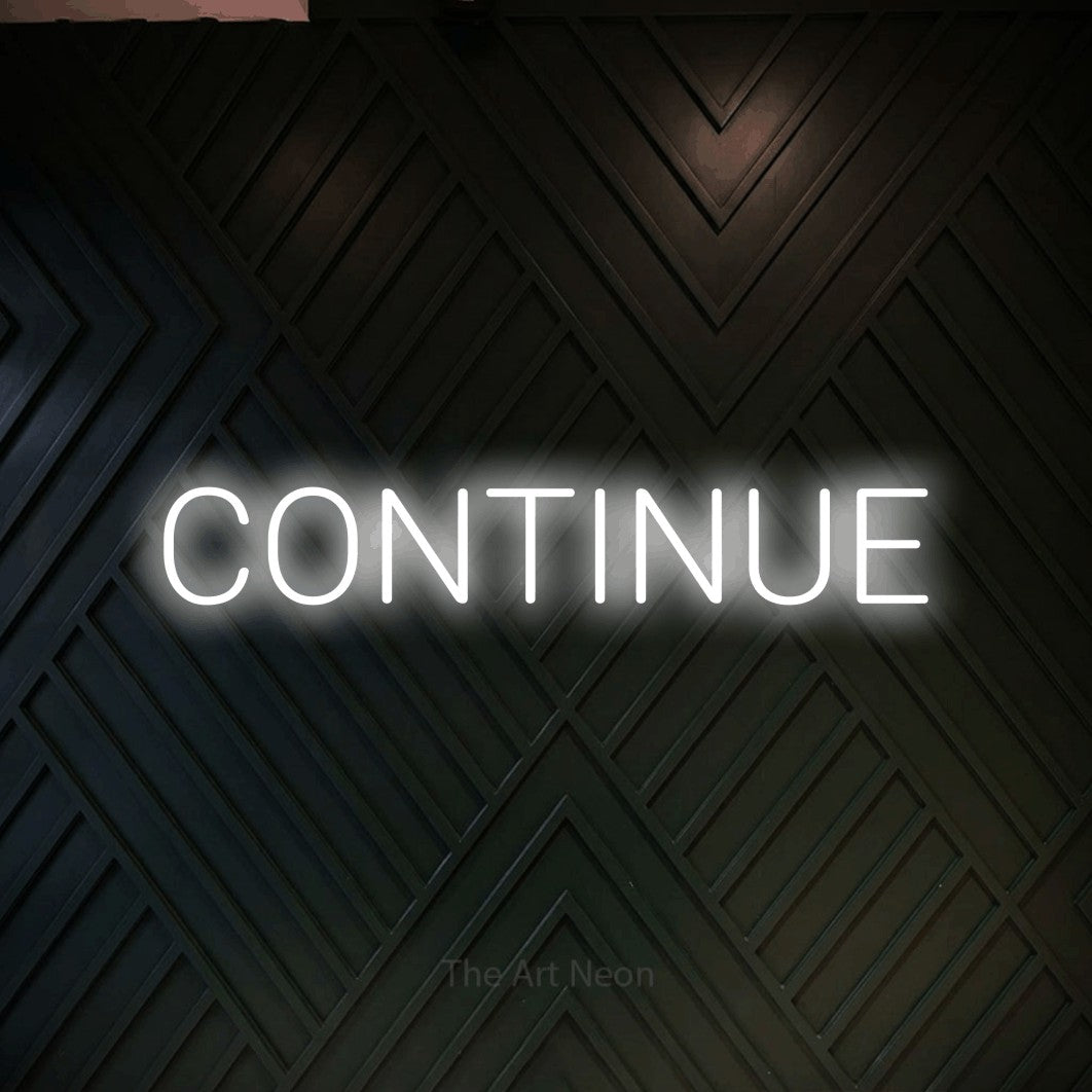 LED neon sign reading “CONTINUE”, arranged in a single line.