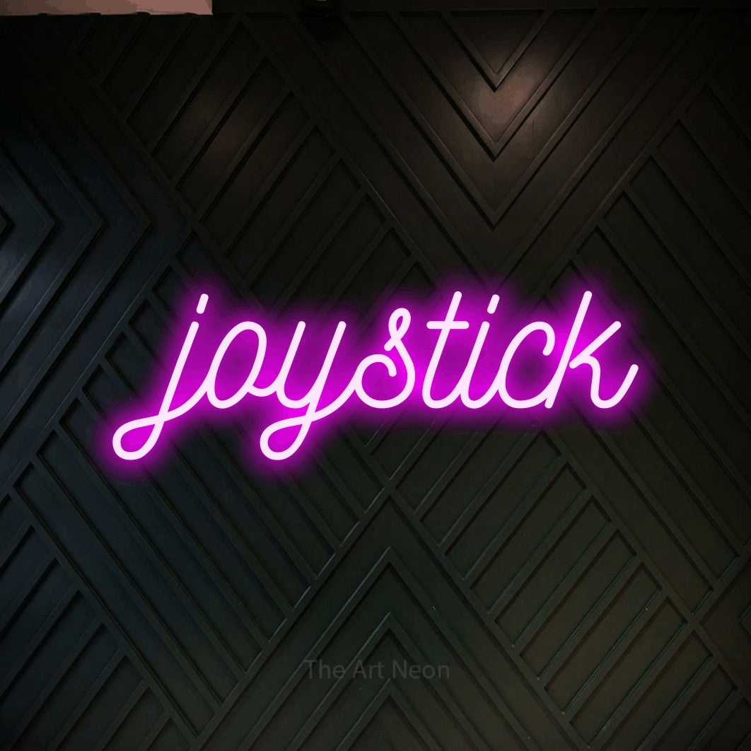 LED neon sign reading “joystick”, arranged in a single line.