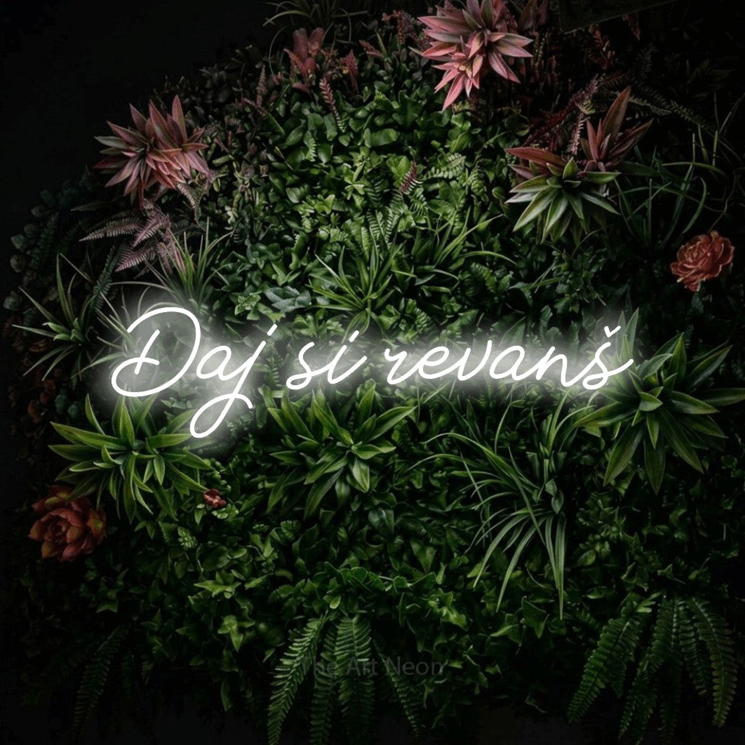 LED neon sign reading “Daj si revanš”, arranged in a single line.
