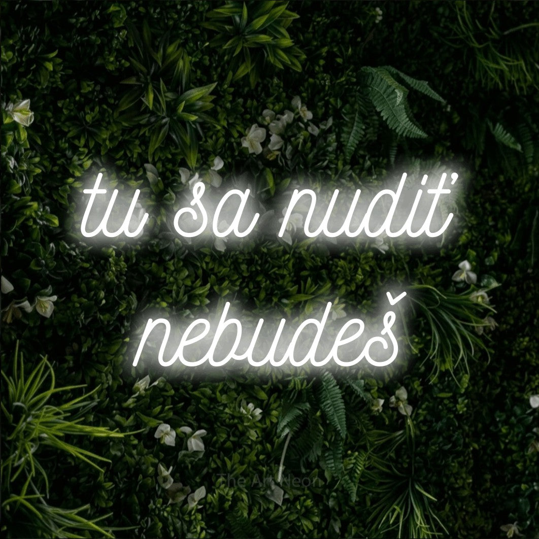 LED neon sign reading “tu sa nudiť nebudeš”, arranged in two lines.