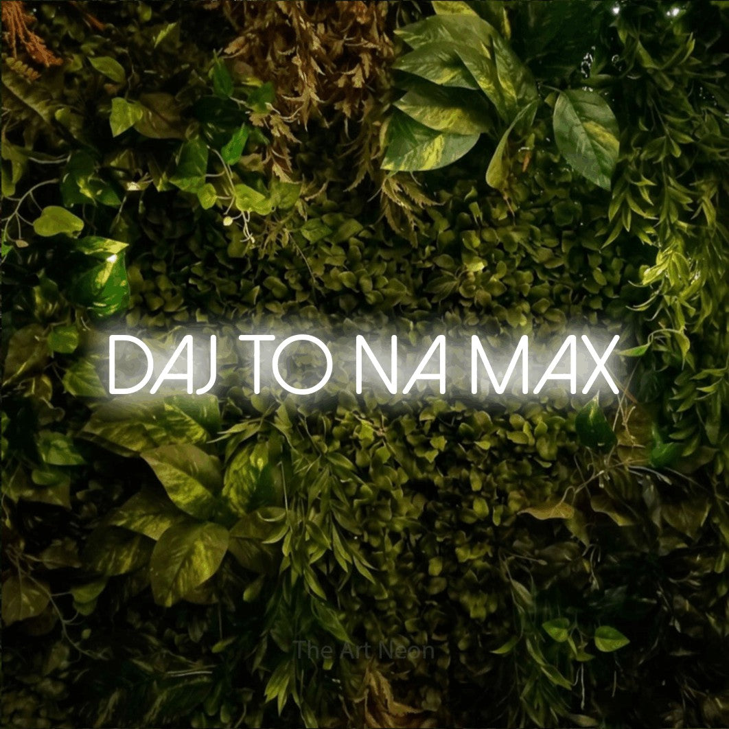 LED neon sign reading “DAJ TO NA MAX”, arranged in a single line.