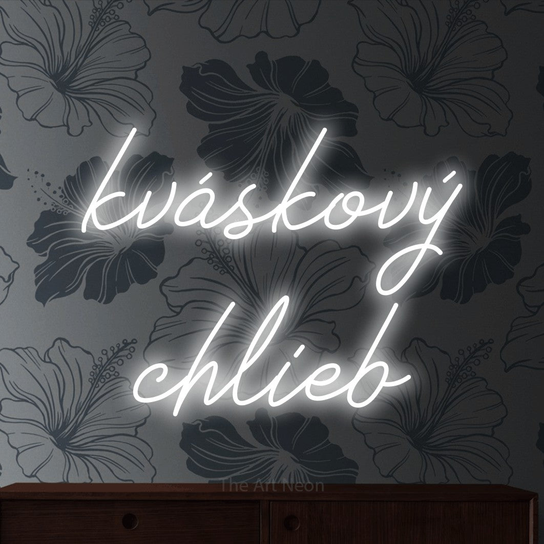 LED neon sign reading “kváskový chlieb”, arranged in two lines.