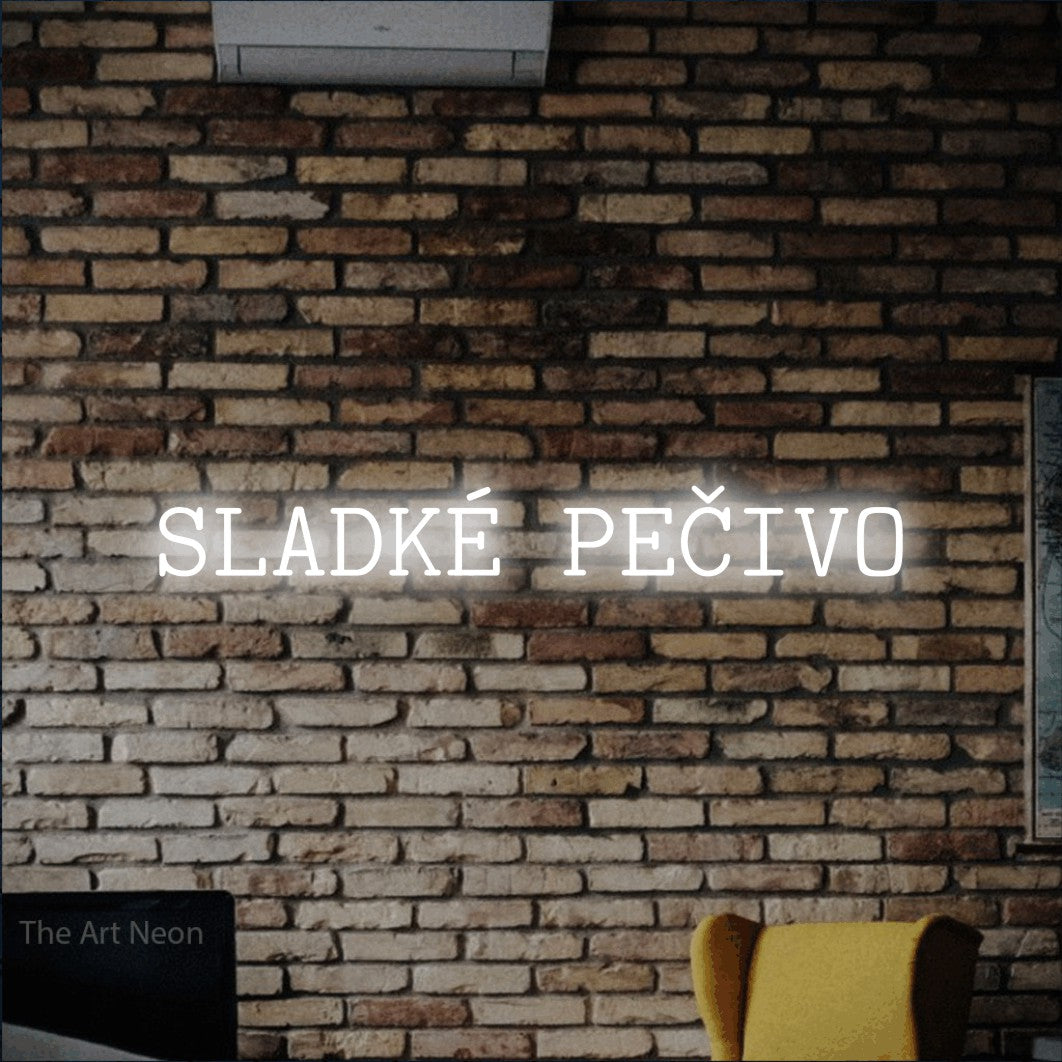 LED neon sign reading “SLADKÉ PEČIVO”, arranged in a single line.