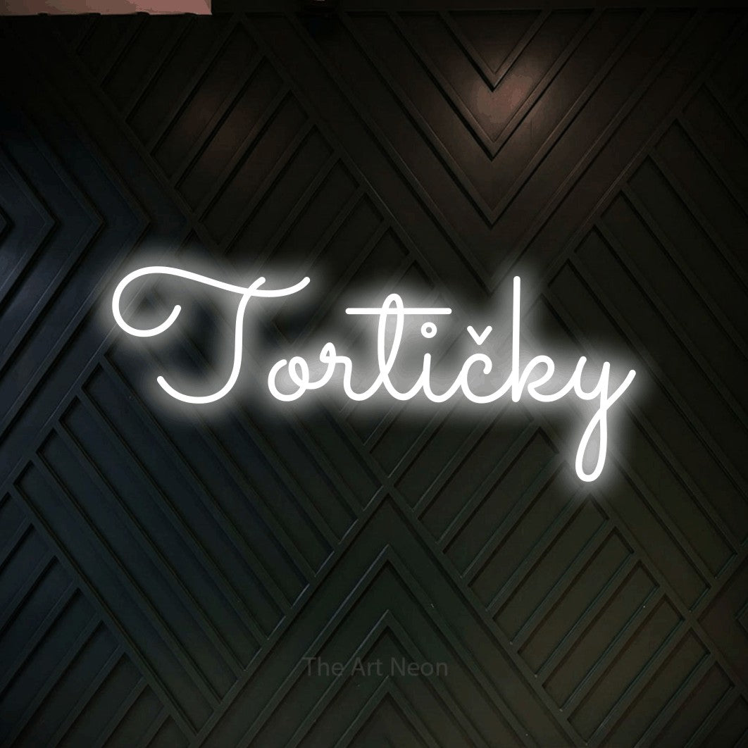 LED neon sign reading “Tortičky”, arranged in a single line.