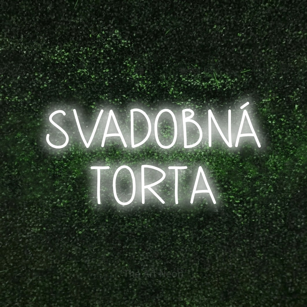 LED neon sign reading “SVADOBNÁ TORTA”, arranged in two lines.