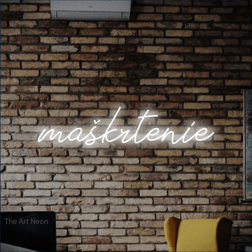LED neon sign reading “maškrtenie”, arranged in a single line.