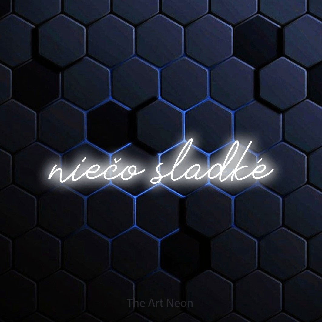 LED neon sign reading “niečo sladké”, arranged in a single line.