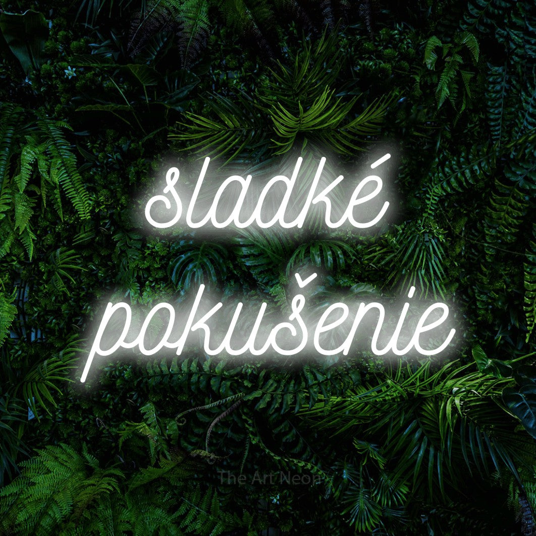 LED neon sign reading “sladké pokušenie”, arranged in two lines.