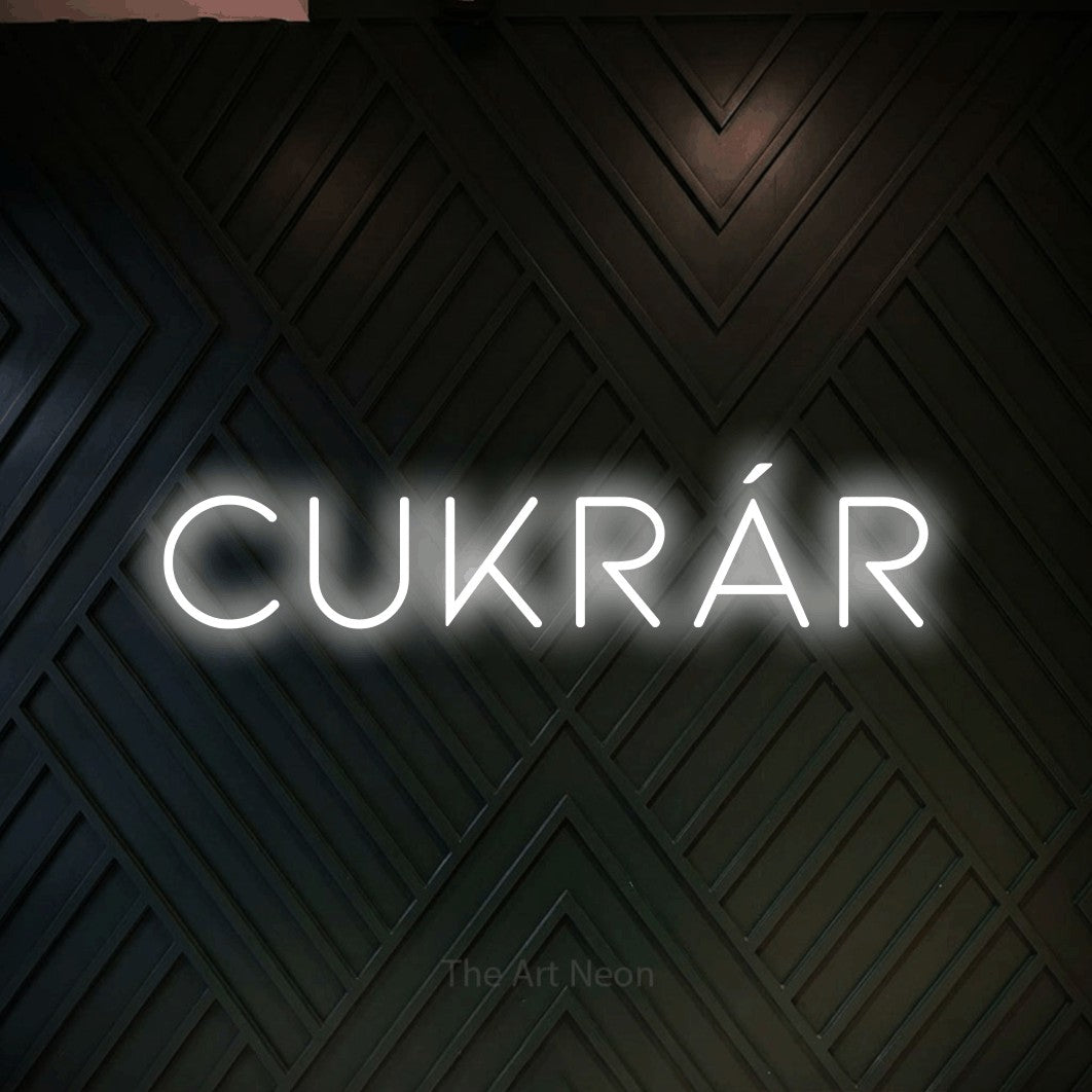 LED neon sign reading “Cukrár”, arranged in a single line.