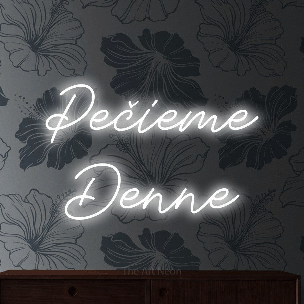 LED neon sign reading “Pečieme Denne”, arranged in two lines.