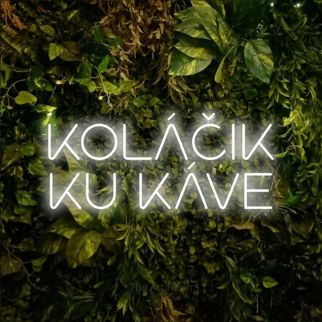 LED neon sign reading “KOLÁČIK KU KÁVE”, arranged in two lines.