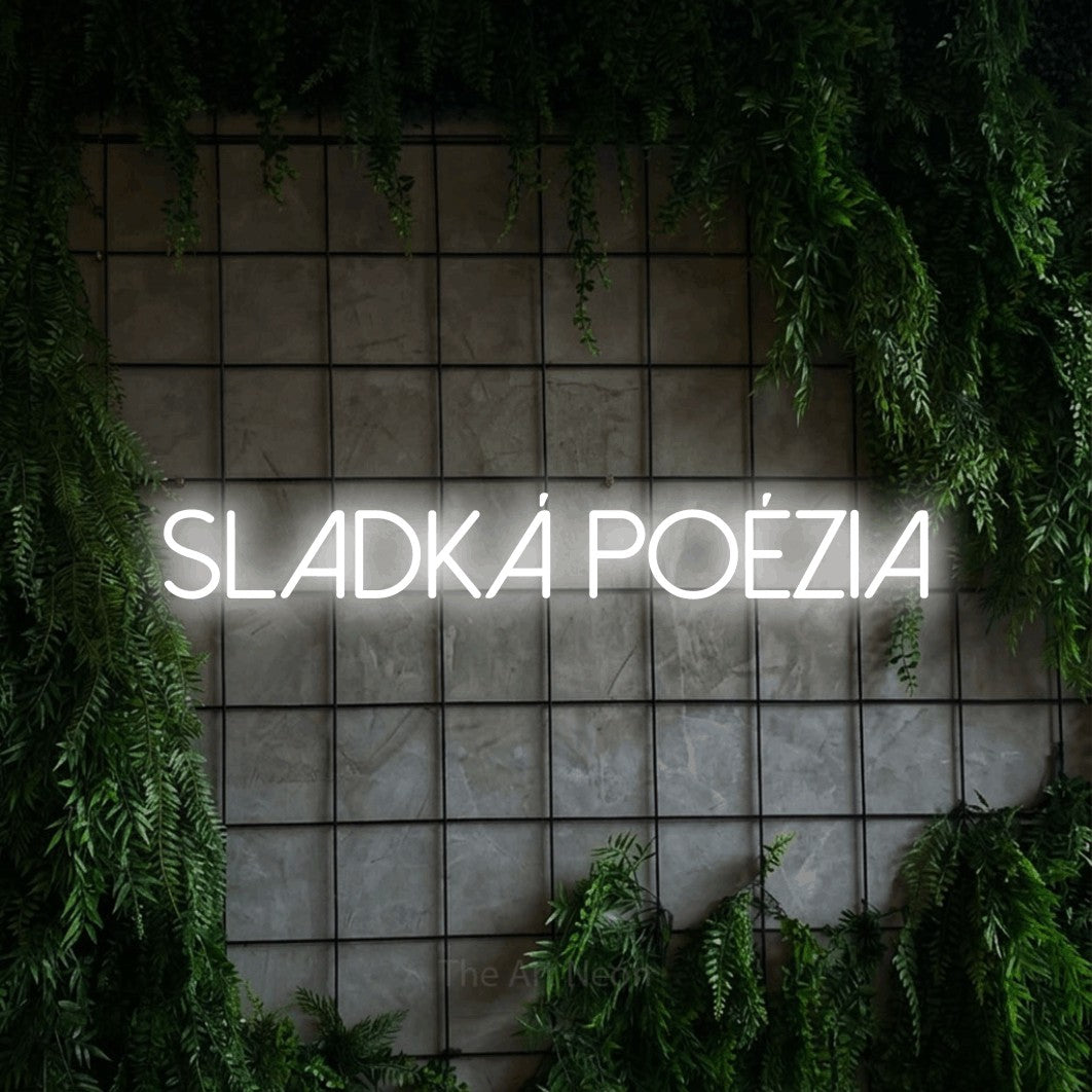 LED neon sign reading “Sladká Poézia”, arranged in a single line.