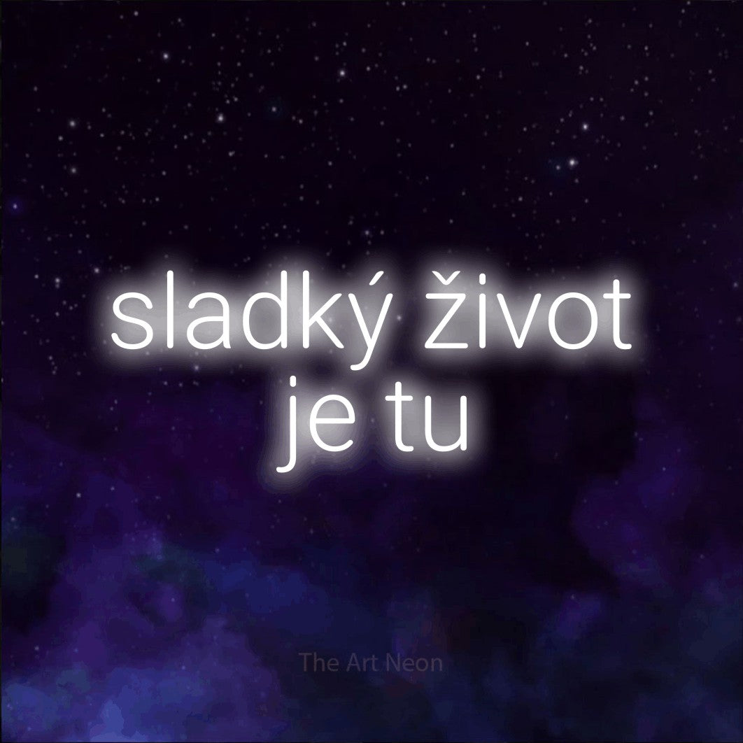 LED neon sign reading “sladký život je tu”, arranged in two lines.