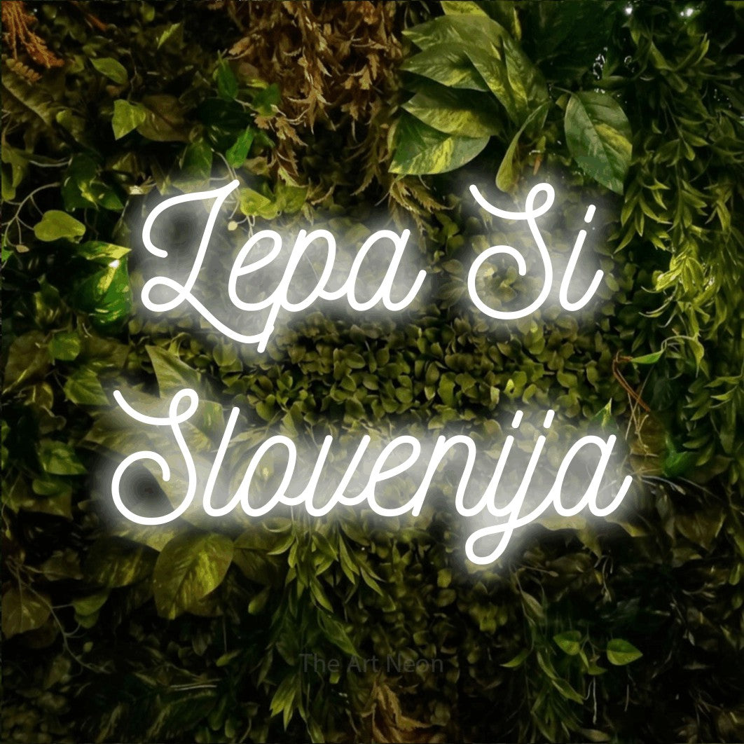 LED neon sign reading “Lepa Si Slovenija”, arranged in two lines.