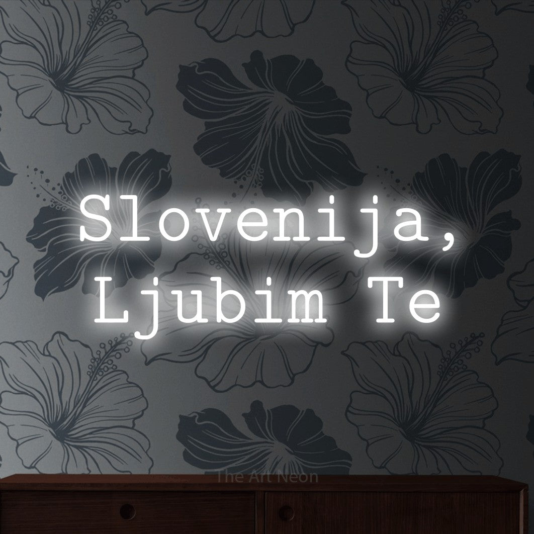 LED neon sign reading “Slovenija, Ljubim Te”, arranged in two lines.