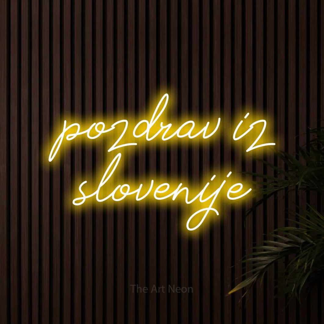 LED neon sign reading “pozdrav iz slovenije”, arranged in two lines.