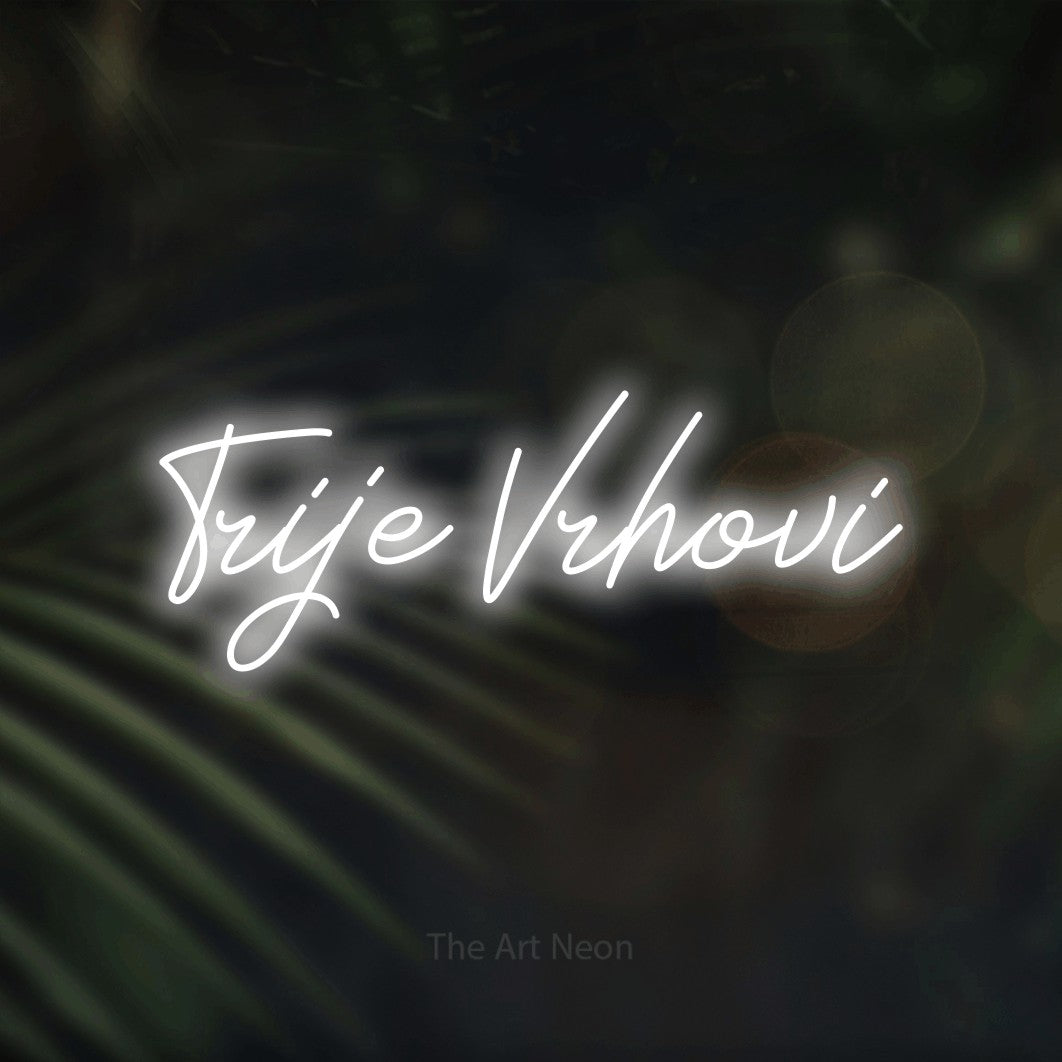 LED neon sign reading “Trije Vrhovi”, arranged in a single line.