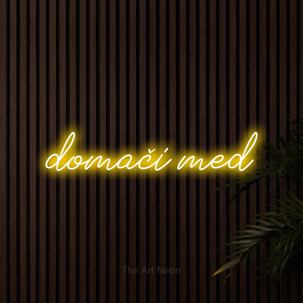 LED neon sign reading “domači med”, arranged in a single line.