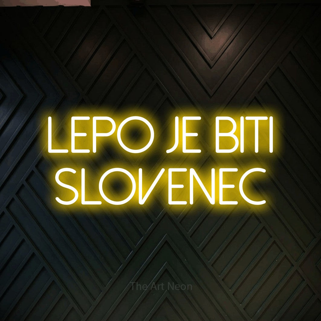 LED neon sign reading “lepo je biti slovenec”, arranged in two lines.