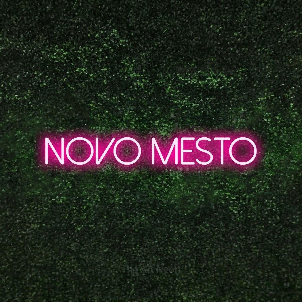 LED neon sign reading “NOVO MESTO”, arranged in a single line.
