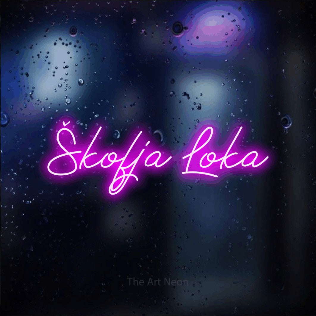 LED neon sign reading “Škofja Loka”, arranged in a single line.