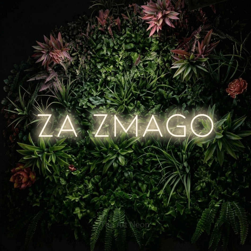 LED neon sign reading “ZA ZMAGO”, arranged in a single line.