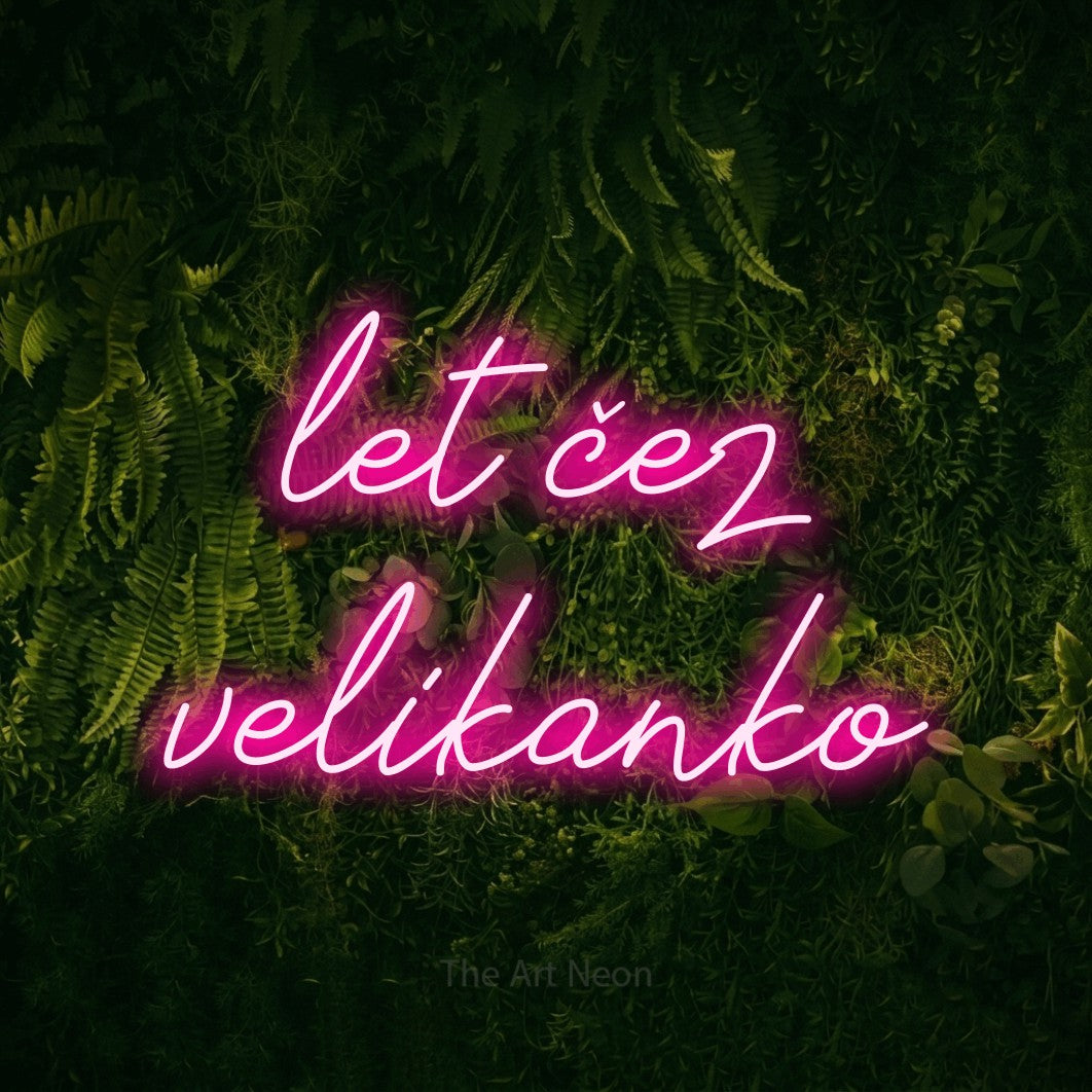 LED neon sign reading “let čez velikanko”, arranged in two lines.