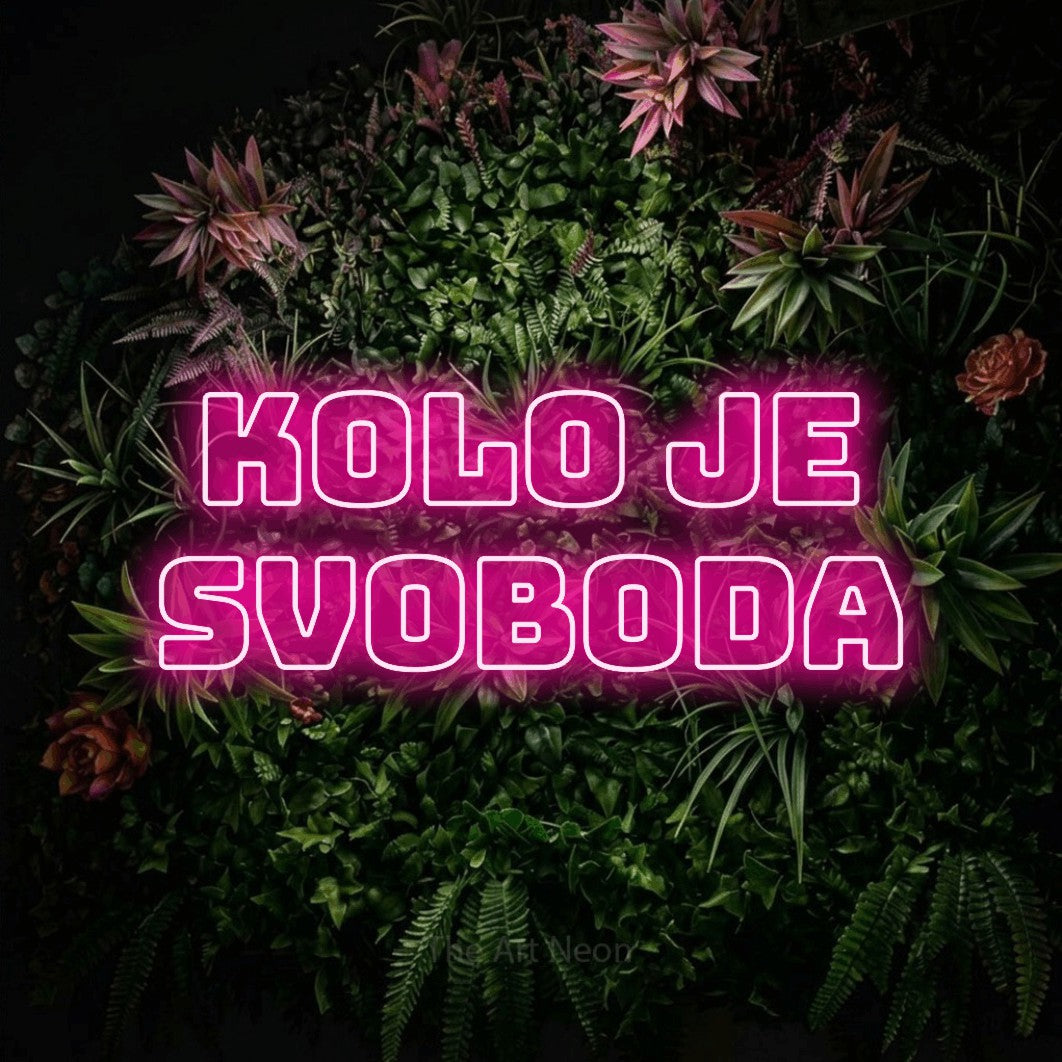 LED neon sign reading “kolo je svoboda”, arranged in two lines.