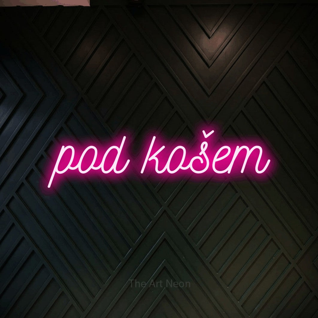 LED neon sign reading “pod košem”, arranged in a single line.