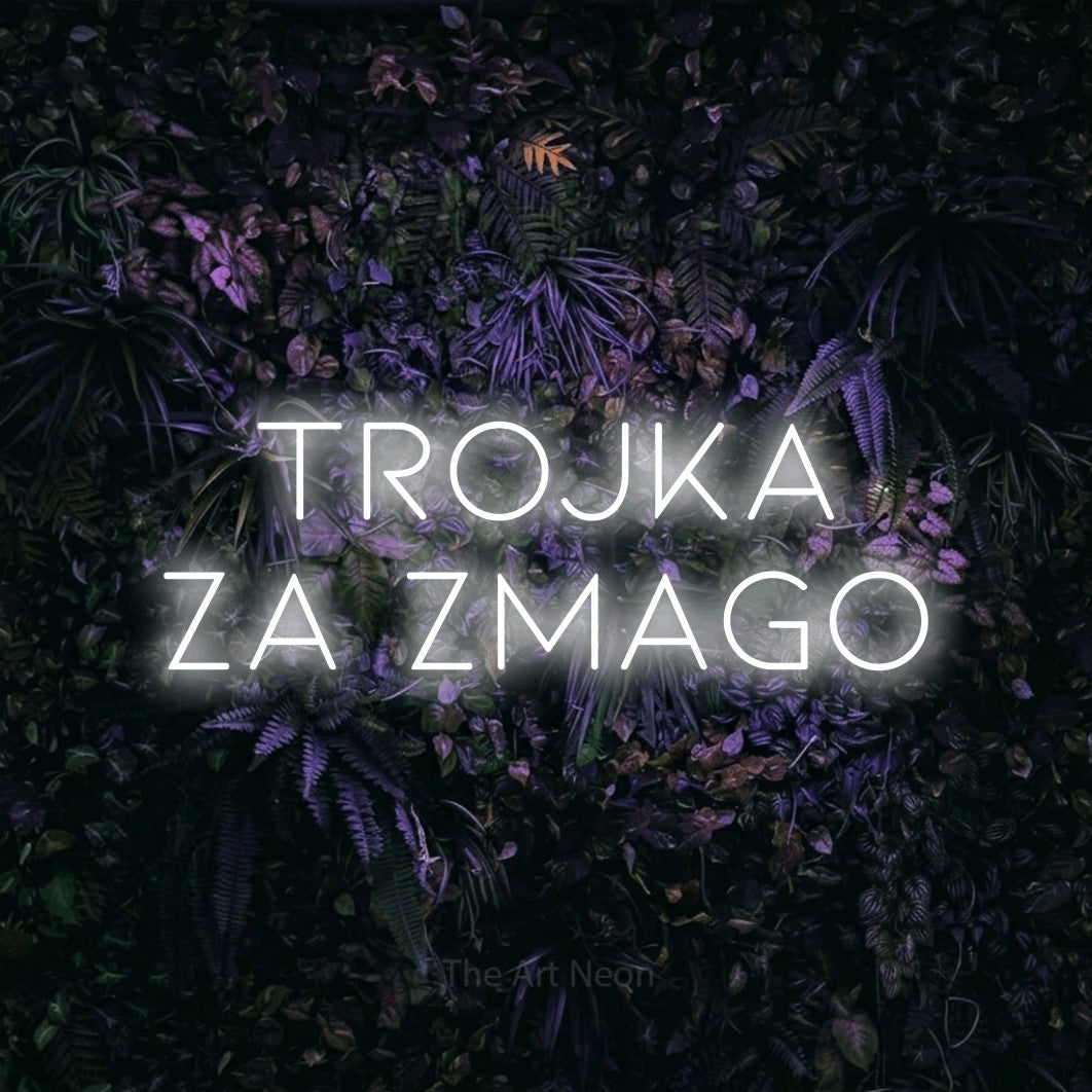 LED neon sign reading “Trojka za Zmago”, arranged in two lines.