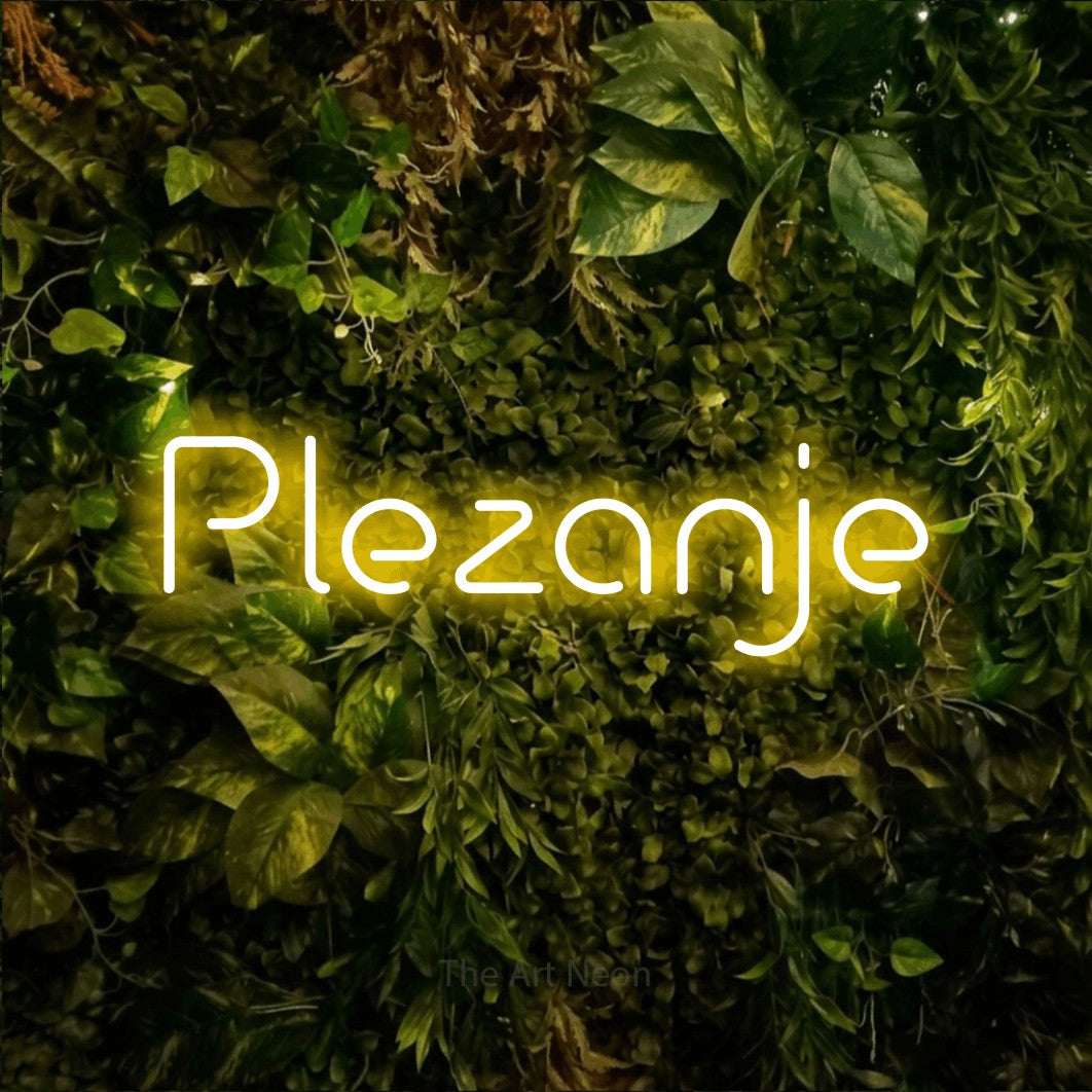 LED neon sign reading “Plezanje”, arranged in a single line.