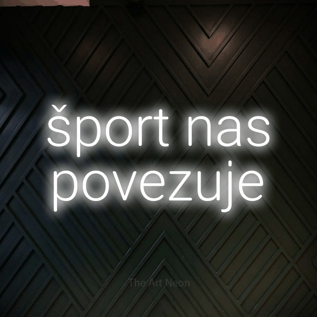 LED neon sign reading “šport nas povezuje”, arranged in two lines.