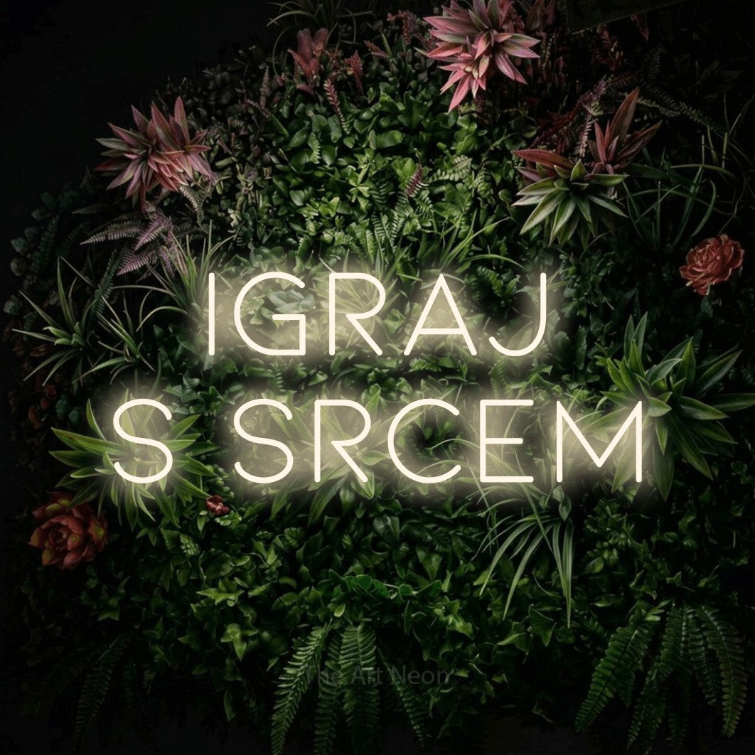 LED neon sign reading “Igraj s Srcem”, arranged in two lines.