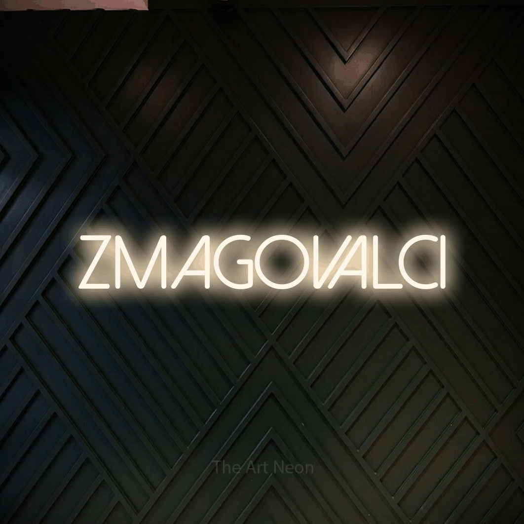 LED neon sign reading “zmagovalci”, arranged in a single line.