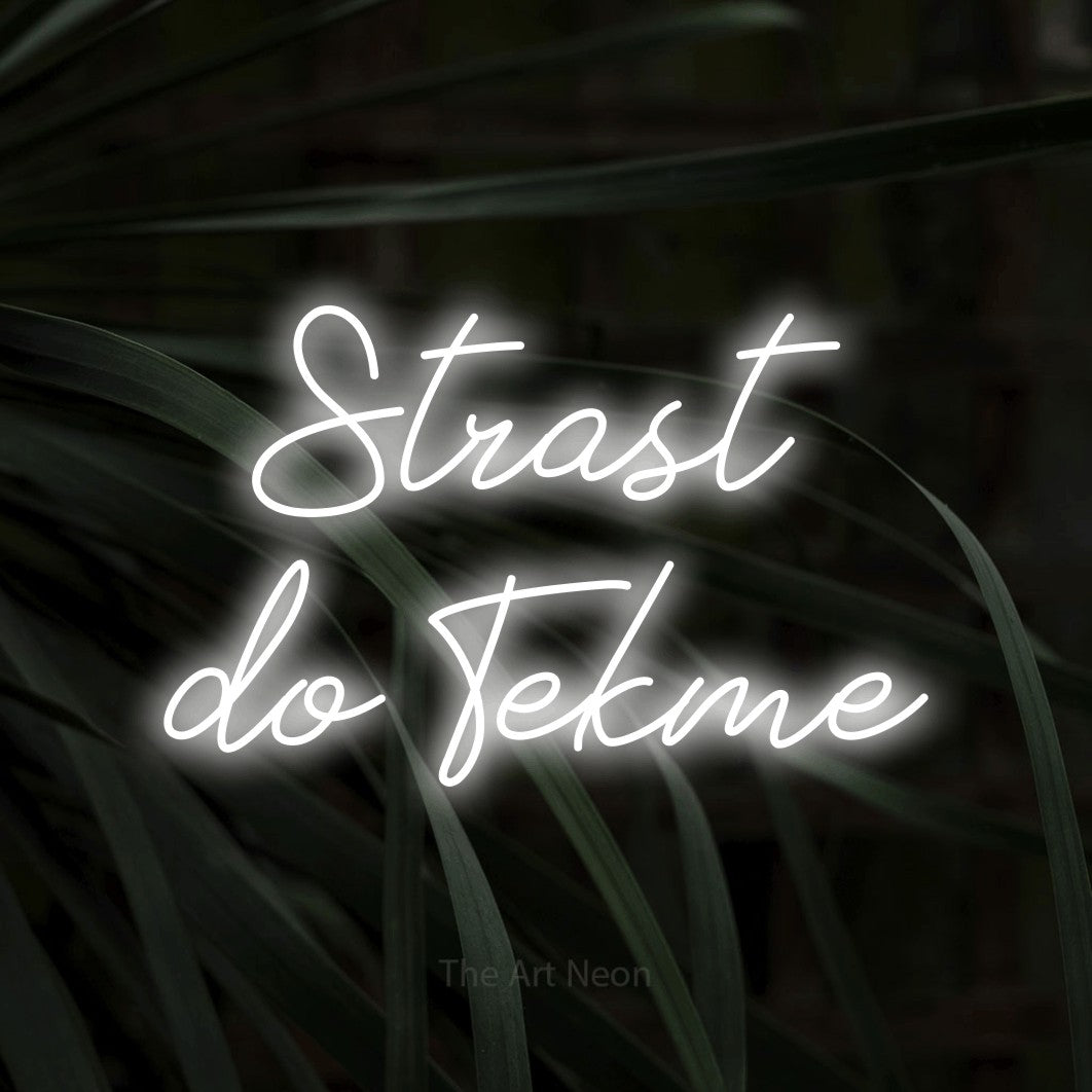 LED neon sign reading “Strast do Tekme”, arranged in two lines.