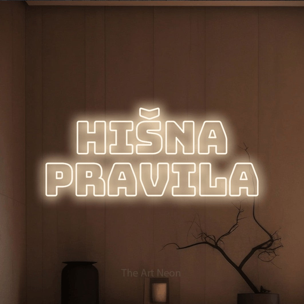 LED neon sign reading “hišna pravila”, arranged in two lines.