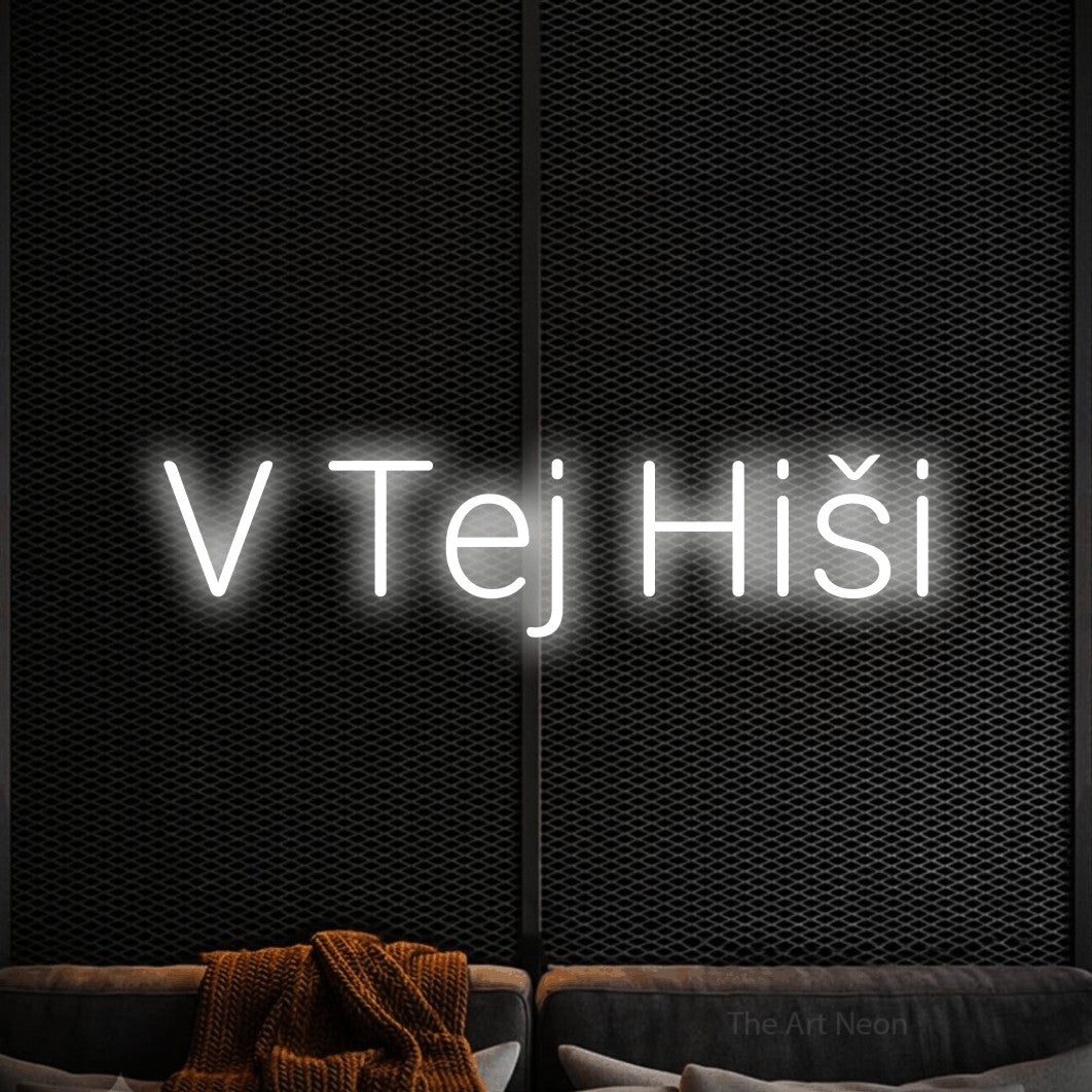 LED neon sign reading “V Tej Hiši”, arranged in a single line.