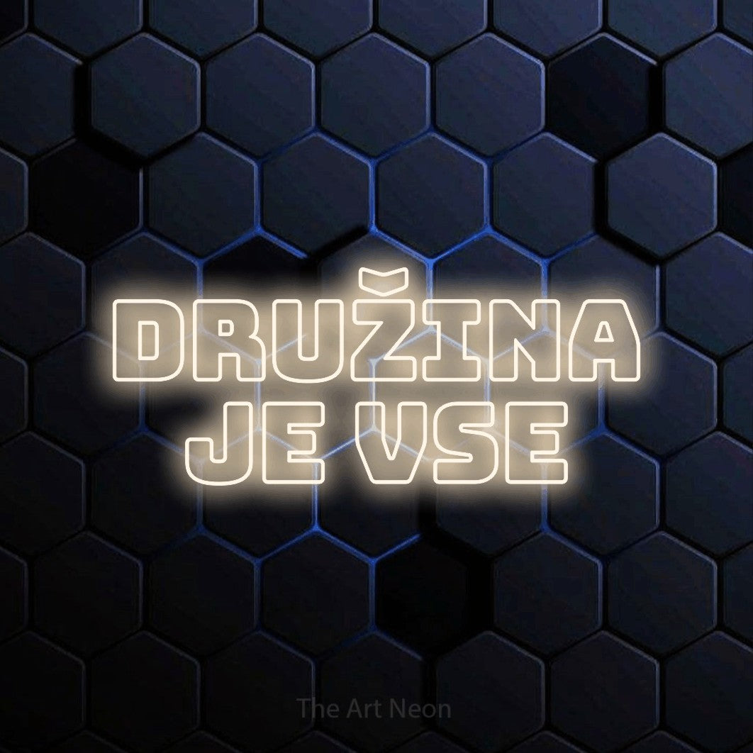 LED neon sign reading “družina je vse”, arranged in two lines.