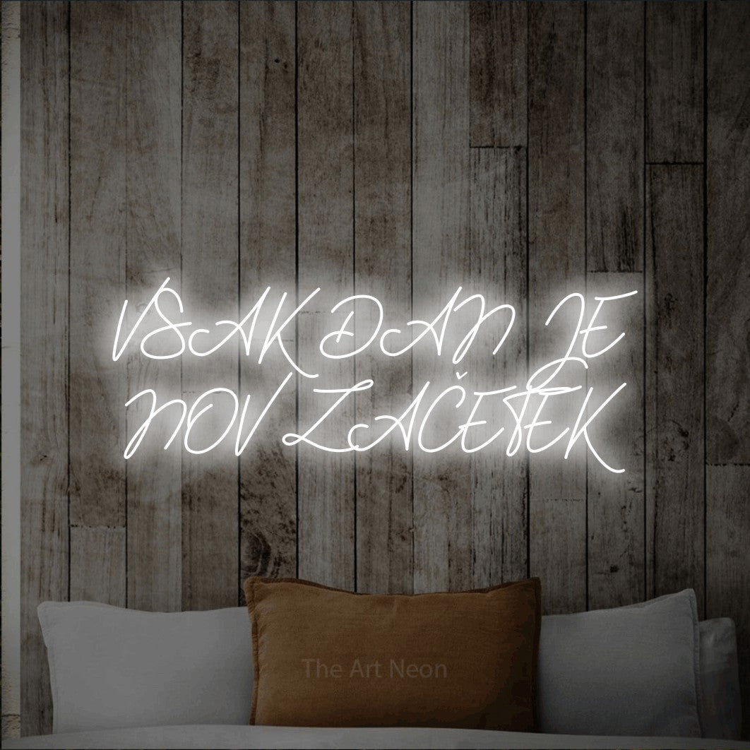 LED neon sign reading “VSAK DAN JE NOV ZAČETEK”, arranged in two lines.