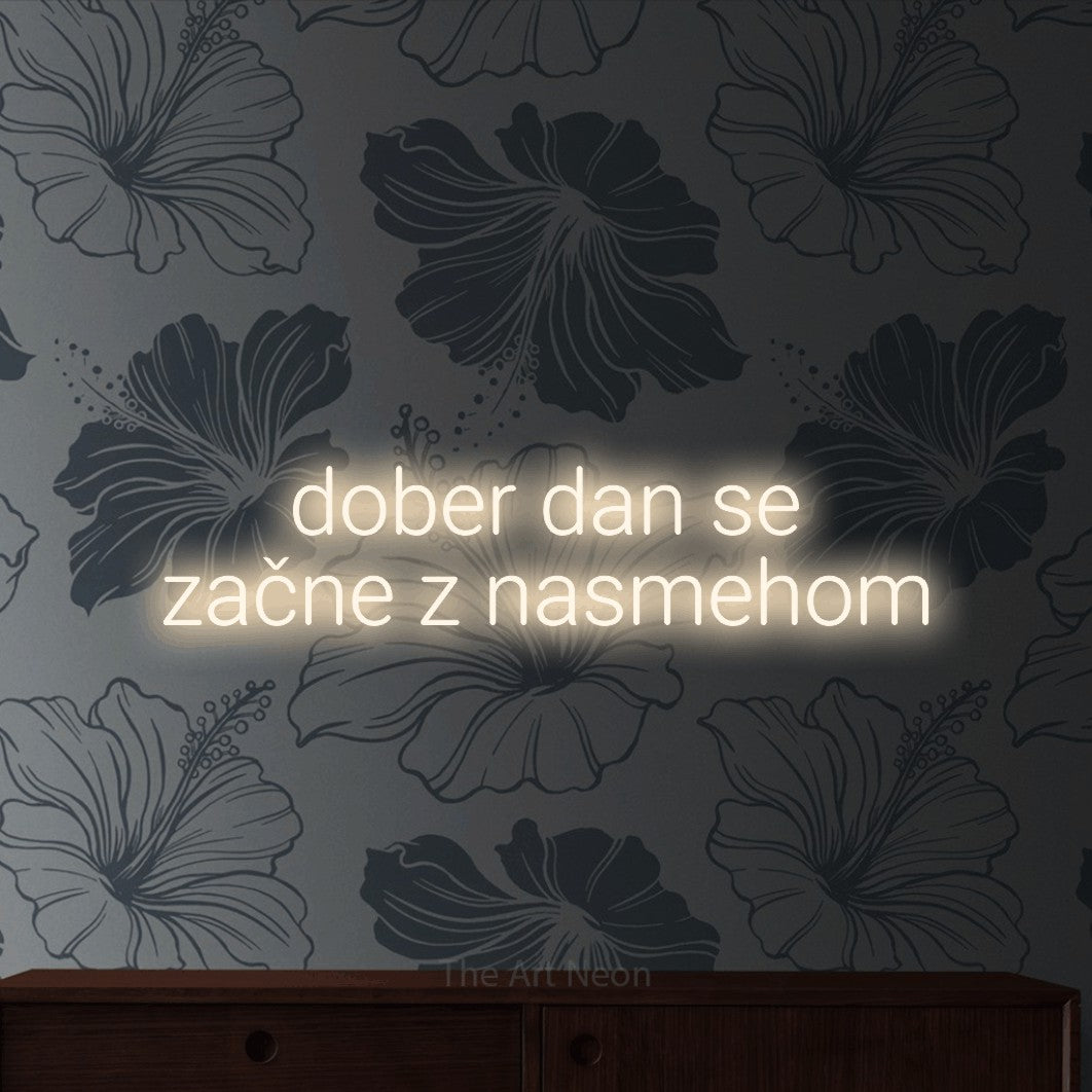 LED neon sign reading “dober dan se začne z nasmehom”, arranged in two lines.