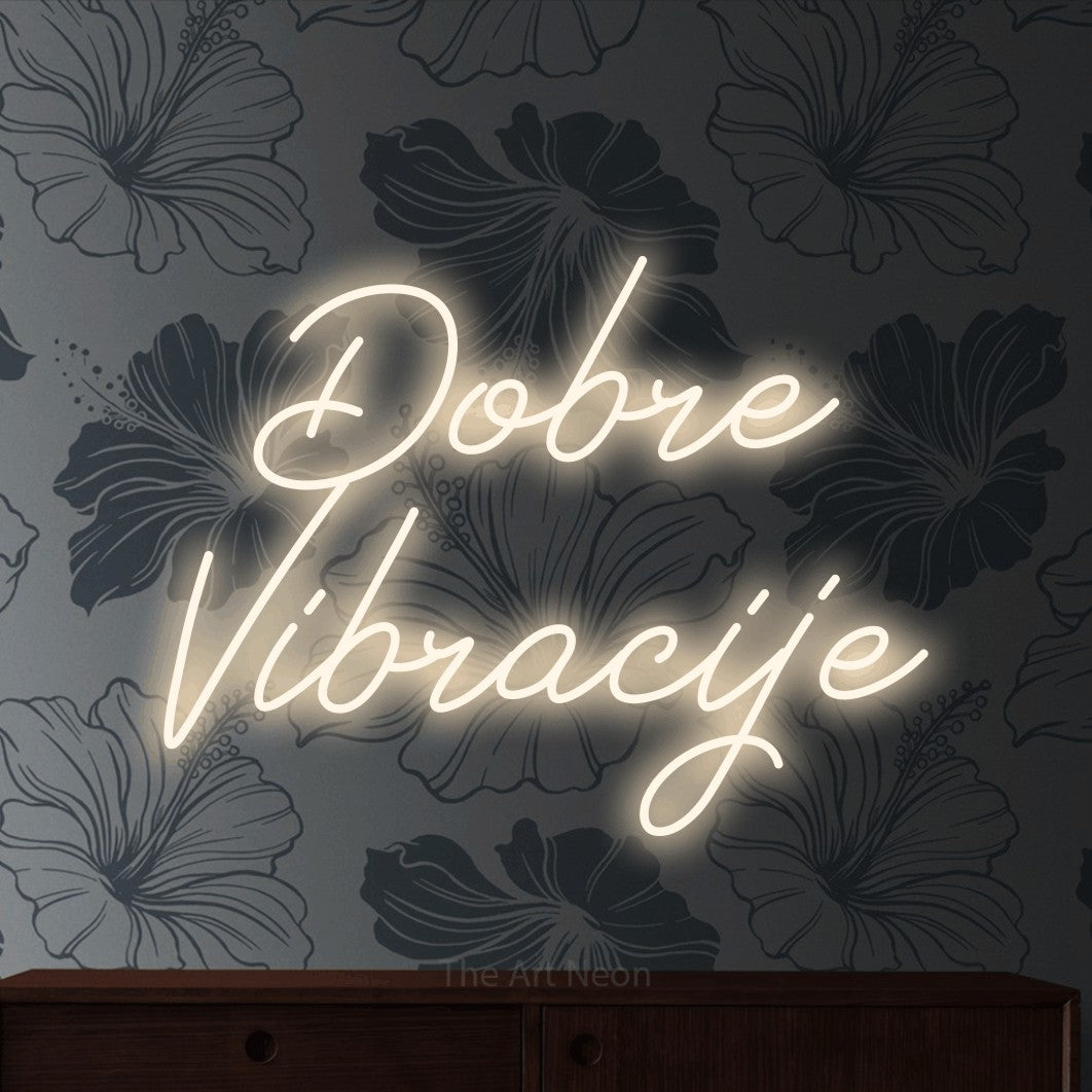 LED neon sign reading “Dobre Vibracije”, arranged in two lines.