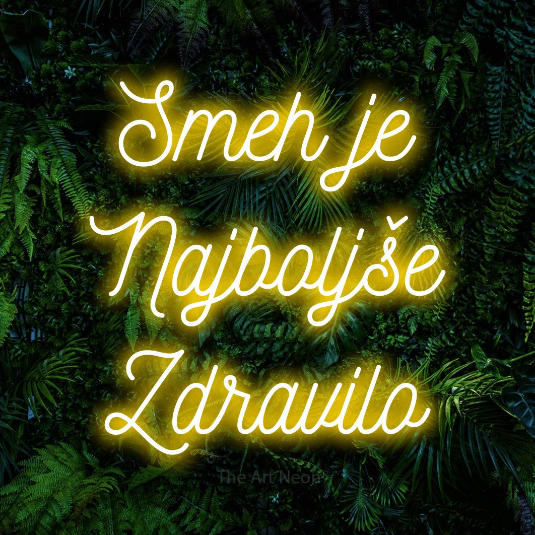 LED neon sign reading “Smeh je Najboljše Zdravilo”, arranged in three lines.