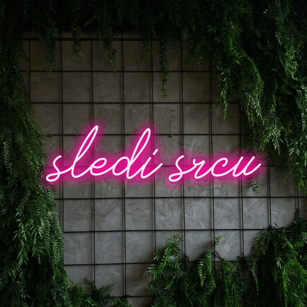 LED neon sign reading “sledi srcu”, arranged in a single line.