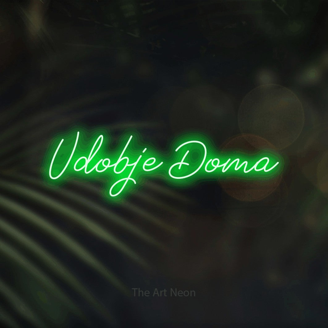 LED neon sign reading “Udobje Doma”, arranged in a single line.