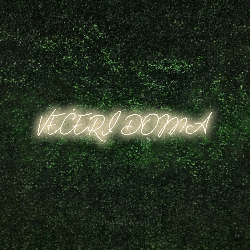 LED neon sign reading “VEČERI DOMA”, arranged in a single line.