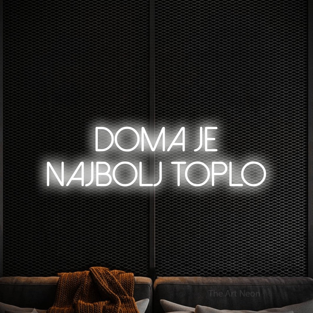 LED neon sign reading “DOMA JE NAJBOLJ TOPLO”, arranged in two lines.