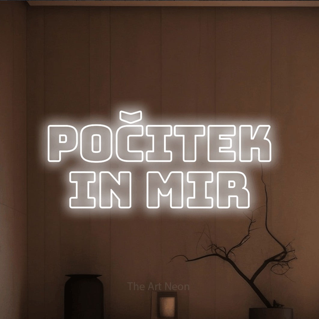 LED neon sign reading “POČITEK in Mir”, arranged in two lines.